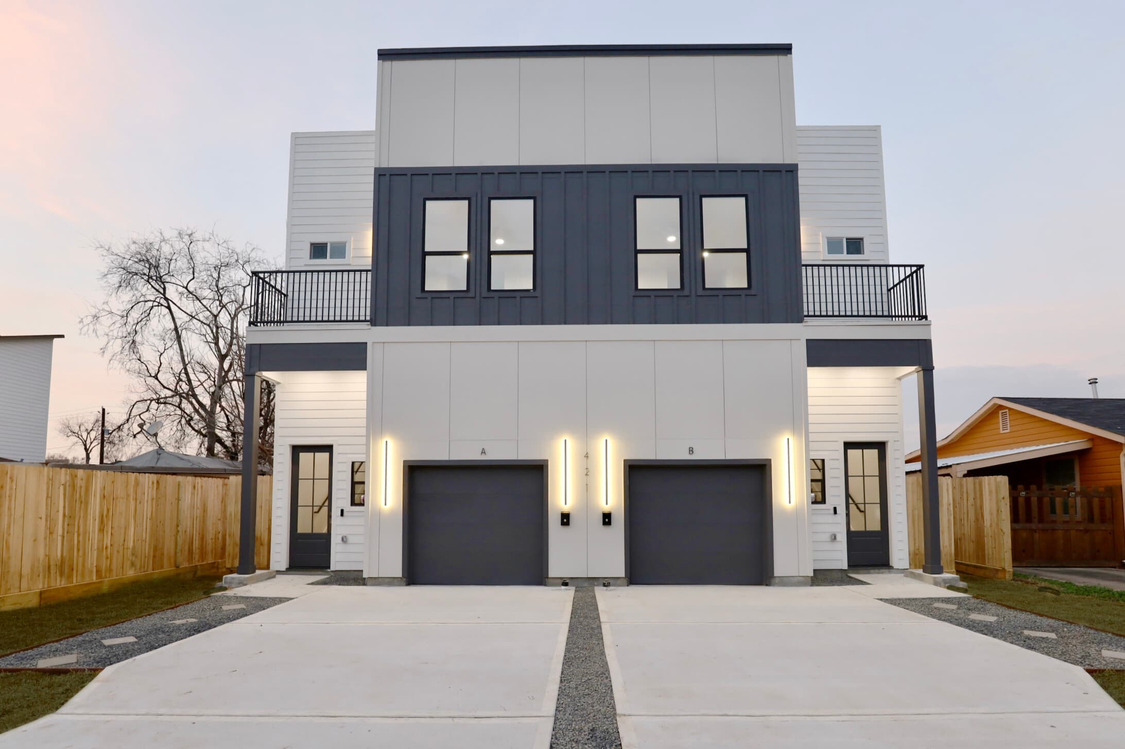Twilight front view of the 421 E 41st duplex